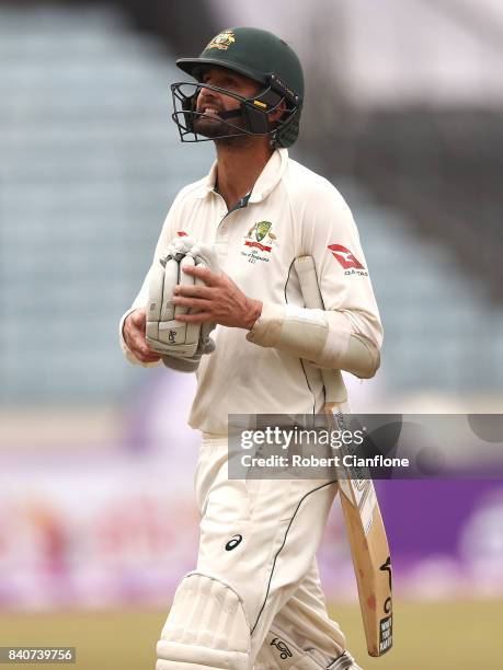 Nathan Lyon of Australia walks off the ground after he was dismissed by Mehedi Hasan Miraj of Bangladesh during day four of the First Test match...