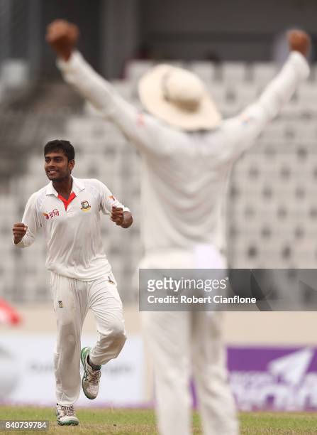Mehedi Hasan Miraj of Bangladesh celebrates taking the wicket of Nathan Lyon of Australia during day four of the First Test match between Bangladesh...