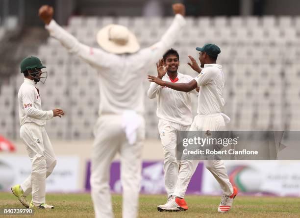 Mehedi Hasan Miraj of Bangladesh celebrates taking the wicket of Nathan Lyon of Australia during day four of the First Test match between Bangladesh...