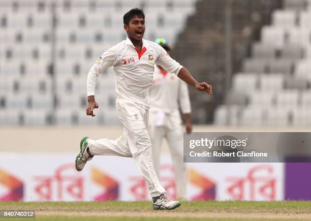 Mehedi Hasan Miraj of Bangladesh celebrates taking the wicket of Nathan Lyon of Australia during day four of the First Test match between Bangladesh...