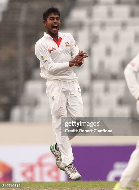 Mehedi Hasan Miraj of Bangladesh celebrates taking the wicket of Nathan Lyon of Australia during day four of the First Test match between Bangladesh...