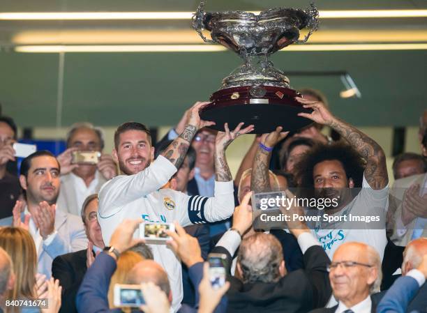 Sergio Ramos of Real Madrid of Real Madrid holds the trophy with teammate Marcelo Vieira Da Silva after winning the Santiago Bernabeu Trophy 2017...