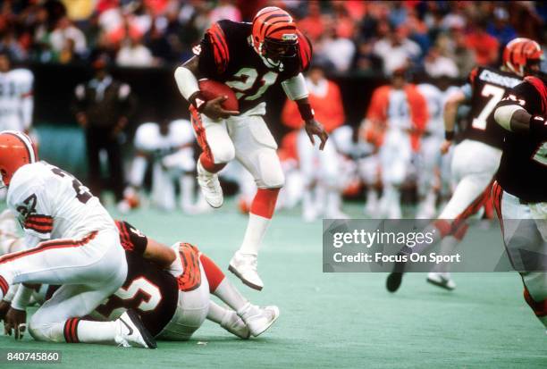 James Brooks of the Cincinnati Bengals carries the ball against the Cleveland Browns during an NFL football game circa 1988 at Riverfront Stadium in...