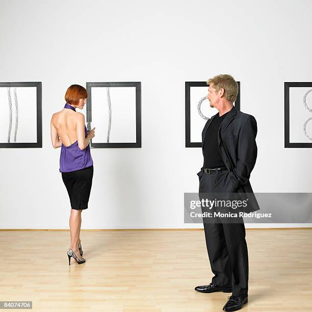 flirtatious couple  - hanging artwork stock pictures, royalty-free photos & images