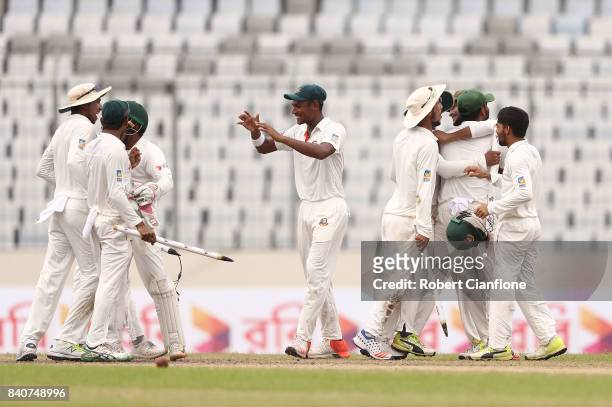 Bangladesh celebrate after they defeated Australia during day four of the First Test match between Bangladesh and Australia at Shere Bangla National...