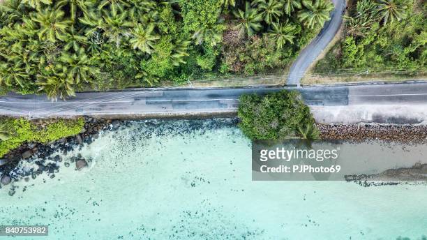 aerial view of main road of mahe island on the sea - seychelles - pjphoto69 stock pictures, royalty-free photos & images