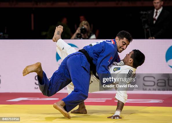 Tal Flicker of Israel throws throws former World champion,