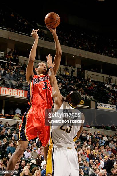 Brandan Wright of the Golden State Warriors shoots over Stephen Graham of the Indiana Pacers at Conseco Fieldhouse on December 18, 2008 in...