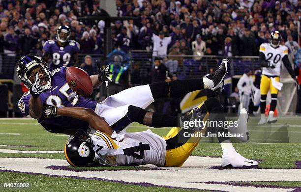 Derrick Mason of the Baltimore Ravens can't hold onto the ball in the endzone as he is defended by Ike Taylor of the Pittsburgh Steelers on December...