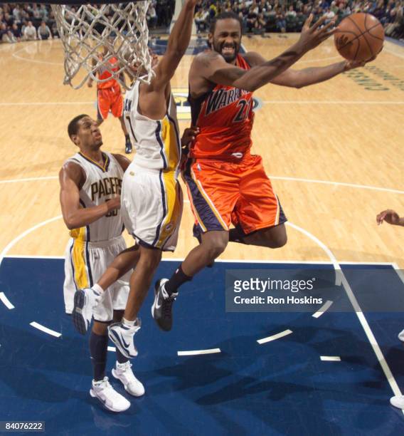 Ronny Turiaf of the Golden State Warriors battles Jarrett Jack of the Indiana Pacers at Conseco Fieldhouse on December 18, 2008 in Indianapolis,...