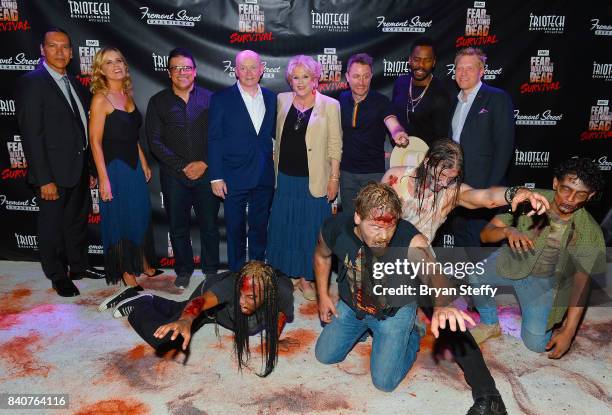 Fear The Walking Dead' television series cast members Michael Greyeyes and Kim Dickens, Triotech President and CEO Ernest Yale, Fremont Street...