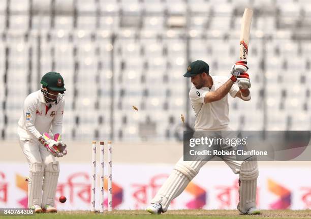 Glenn Maxwell of Australia is bowled by Shakib Al Hasan of Bangladesh during day four of the First Test match between Bangladesh and Australia at...