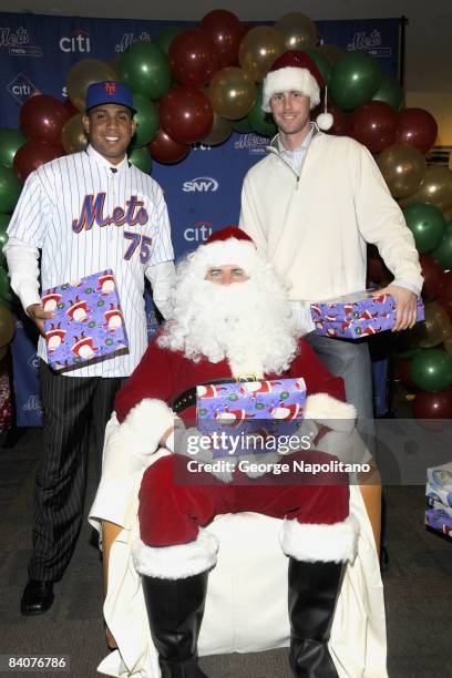 Rod" Francisco Rodriguez, Mike Pelfrey and John Maine attend the New York Mets annual holiday party to benefit local children at the Citi Building on...