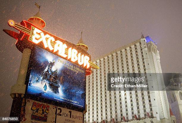 Snow falls outside Excalibur Hotel & Casino on the Las Vegas Strip during a rare snowstorm December 17, 2008 in Las Vegas, Nevada. Several inches of...