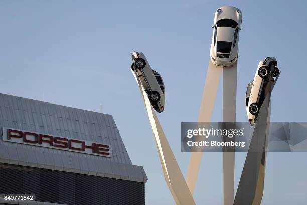 Sculpture of Porsche 911 automobiles stands on display outside the Porsche AG factory in Stuttgart, Germany, on Tuesday, Aug. 29, 2017. The Porsche...