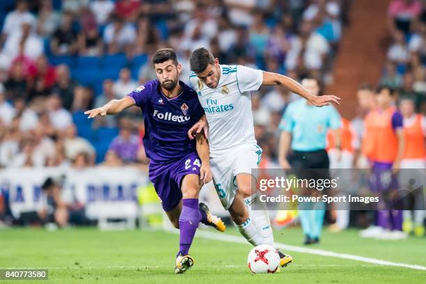 Theo Hernandez of Real Madrid fights for the ball with Marco Benassi of ACF Fiorentina during the Santiago Bernabeu Trophy 2017 match between Real...