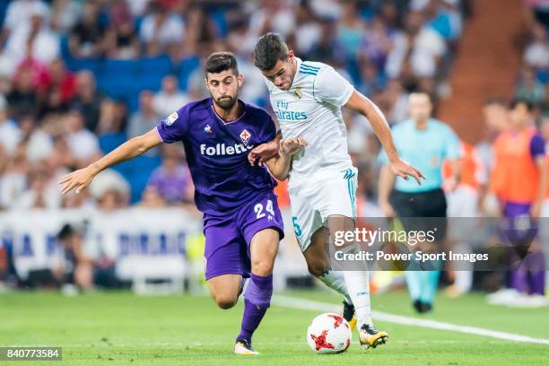 Theo Hernandez of Real Madrid fights for the ball with Marco Benassi of ACF Fiorentina during the Santiago Bernabeu Trophy 2017 match between Real...