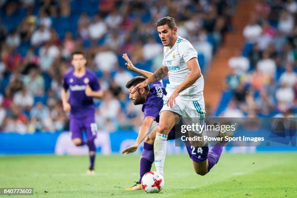Theo Hernandez of Real Madrid fights for the ball with Marco Benassi of ACF Fiorentina during the Santiago Bernabeu Trophy 2017 match between Real...