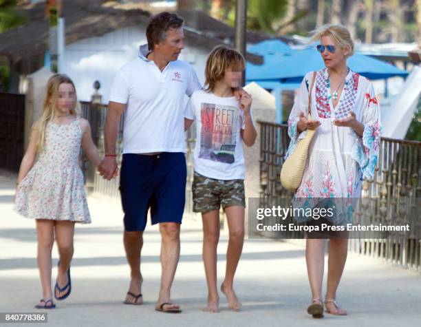 Part of this image has been pixellated to obscure the identity of the child). Model Valeria Mazza, her husband Alejandro Gravier, their son Benicio...