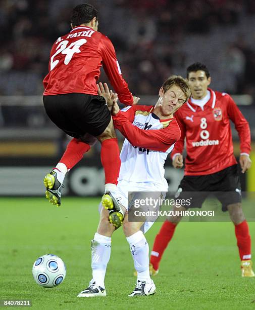 Australia's Adelaide United defender Scott Jamieson collides with Egypt's Al Ahly midfielder Ahmed Fathi in the playoff for 5th place at the FIFA...