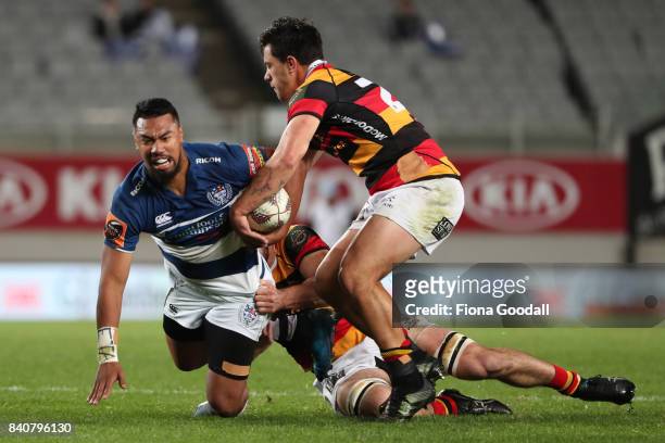 Otumaka Mausia of Auckland is tackled by Sam Christie of Waikato during the round three Mitre 10 Cup match between Auckland and Waikato at Eden Park...