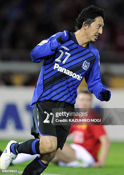 Japan's Gamba Osaka midfielder Hideo Hashimoto celebrates his goal against Manchester United in the air in the semi-final of the FIFA Club World Cup...