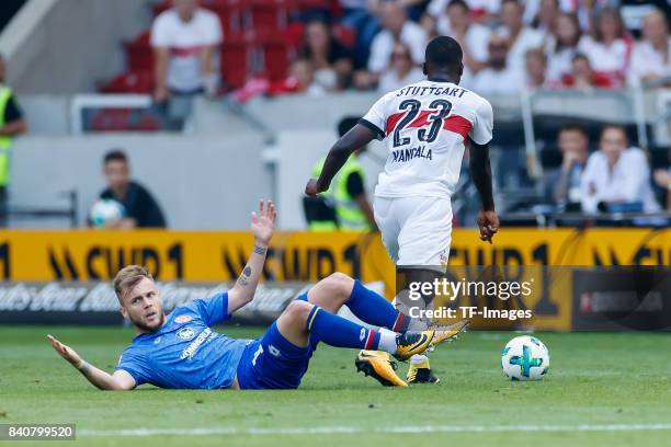 Alexandru Maxim of Mainz and Orel Mangala of Stuttgart battle for the ball during the Bundesliga match between VfB Stuttgart and 1.FSV Mainz 05 at...