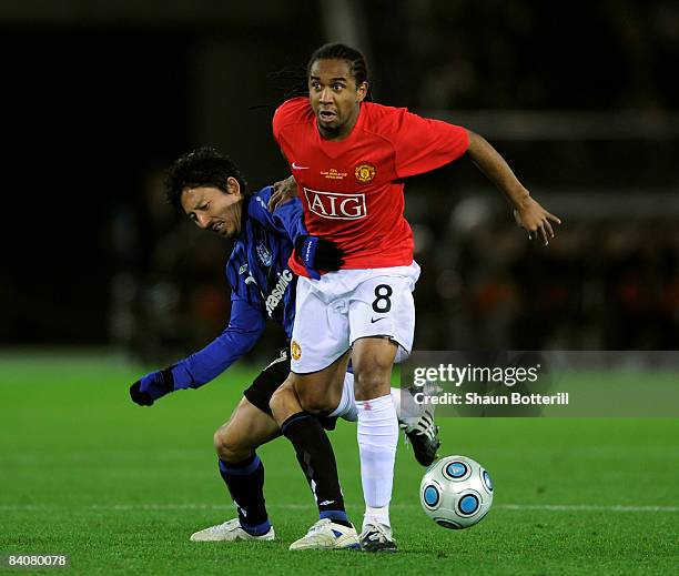 Anderson of Manchester United holds off a challenge from Hideo Hashimoto of Gamba Osaka during the FIFA Club World Cup Japan 2008 Semi Final match...