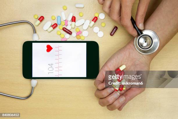 smart phone doctor.  medical concept - stethoscope pills stock pictures, royalty-free photos & images