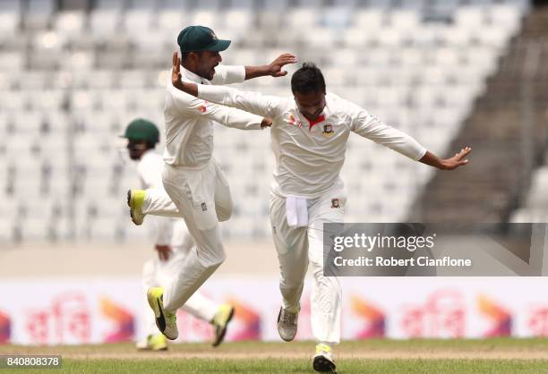 Shakib Al Hasan of Bangladesh celebrates taking the wicket of Glenn Maxwell of Australia during day four of the First Test match between Bangladesh...