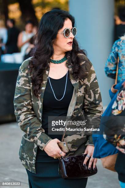 Visitor poses, fashion detail sunglass and jacket during Sao Paulo Fashion Week N44 SPFW Winter 2018 at Ibirapuera's Bienal Pavilion on August 29,...