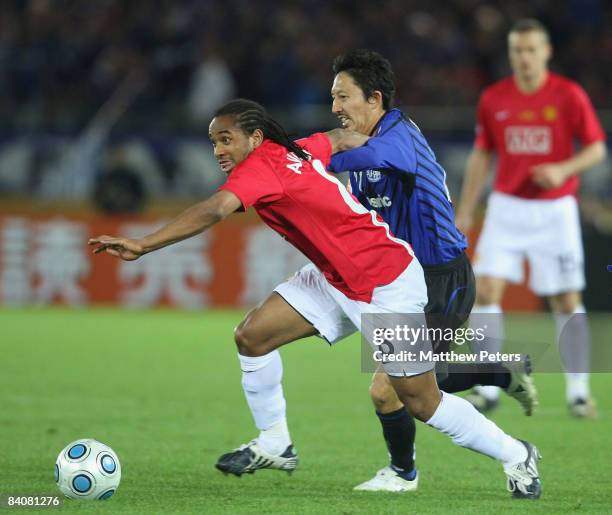 Anderson of Manchester United clashes with Hideo Hashimoto of Gamba Osaka during the FIFA World Club Cup Semi-Final match between Gamba Osaka and...