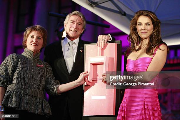 Kathleen Bartels, Gary Balasky and Elizabeth Hurley flip a switch to illuminate the Vancouver Art Gallery in support with Estee Lauder for the Breast...