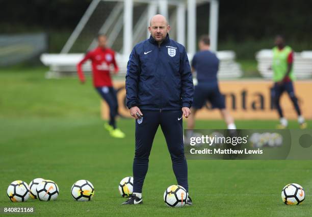 Coach Lee Carsley looks on during an England Under 21 training session at St George's Park on August 30, 2017 in Burton-upon-Trent, England.