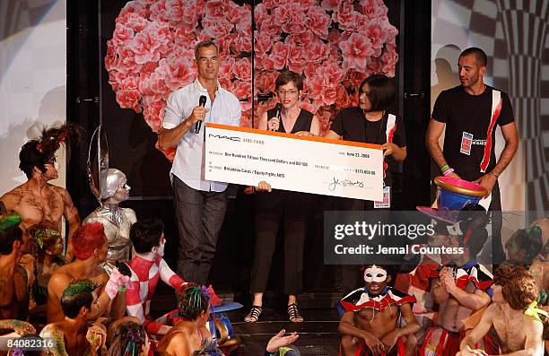 Choregrapher Jerry Mitchell accepts a check for $115,000 from Mac Aids Fund on behalf of Broadway Bares at Broadway Bares 18: Wonderland on June 22,...