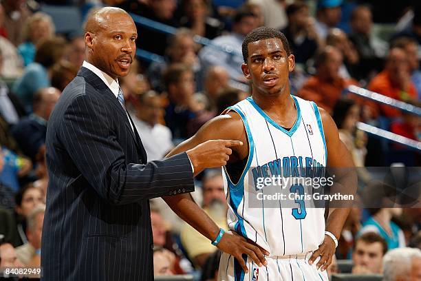 Head coach Byron Scott talks with Chris Paul of New Orleans Hornets during a timeout against the Phoenix Suns at the New Orleans Arena on December 3,...