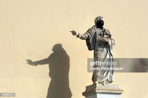 Statue of 19th century Christian Orthodox patriarch Pope Gregory V stands graffitied with black spray paint and anarchic symbol during renewed...