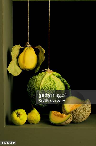 quince and cabbage suspended - low hanging fruit stock pictures, royalty-free photos & images