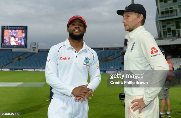 Shai Hope of the West Indies stands with Joe Root of England waiting for the presentations after the 2nd Investec Test match between England and the...