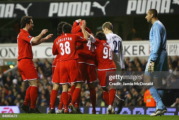 Dejected Heurelho Gomes of Spurs looks on as Artem Dzuba of Spartak is congratulated by teammates after scoring the opening goal during the UEFA Cup...