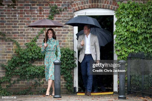 Catherine, Duchess of Cambridge and Prince William, Duke of Cambridge are seen during a visit to The Sunken Garden at Kensington Palace on August 30,...