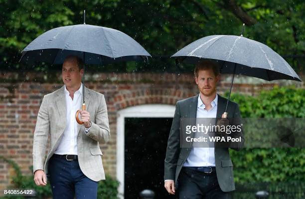Prince William, Duke of Cambridge and Prince Harry are seen during a visit to The Sunken Garden at Kensington Palace on August 30, 2017 in London,...