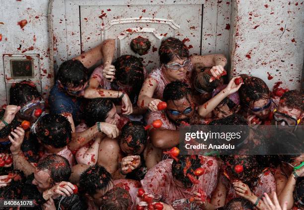 Revelers hurl tomatoes during the annual La Tomatina festival in Bunol district of Valencia, Spain on August 30, 2017.