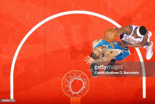 Al Thornton of the Los Angeles Clippers goes to the basket under pressure against Tyson Chandler of the New Orleans Hornets during the game on...