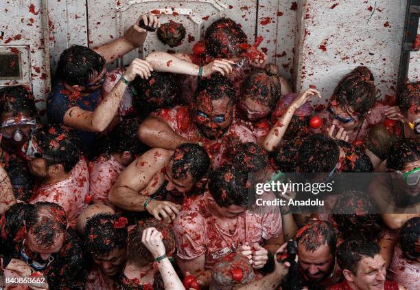 Revelers hurl tomatoes during the annual La Tomatina festival in Bunol district of Valencia, Spain on August 30, 2017.