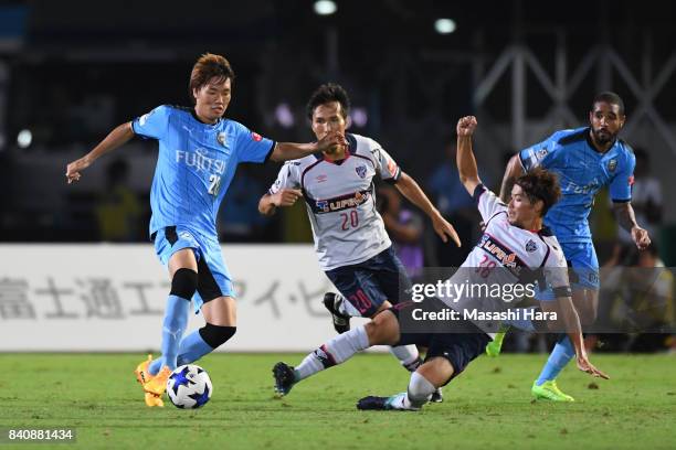 Ko Itakura of Kawasaki Frontale and Keigo Higashi of FC Tokyo and compete for the ball during the J.League Levain Cup quarter final first leg match...