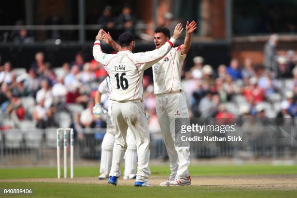 Ryan McLaren of Lancashire celebrates after getting Ian Bell of Warwickshire out during the County Championship Division One match between Lancashire...