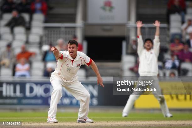 Ryan McLaren of Lancashire appeals after getting Jonathan Trott of Warwickshire out during the County Championship Division One match between...