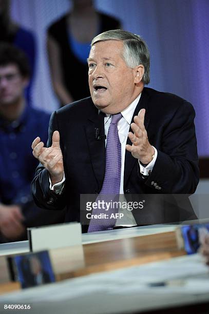 French journalist Alain Duhamel gestures as he takes part in French TV channel Canal + talk show "Le Grand Journal" on December 19, 2008 in Paris....