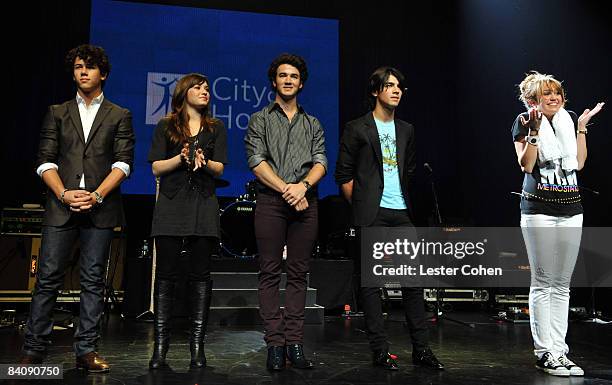 Nick Jonas, Demi Lovato, Kevin Jonas, Joe Jonas and Miley Cyrus attend the City of Hope Benefit Concert with Miley Cyrus & Jonas Brothers at the...